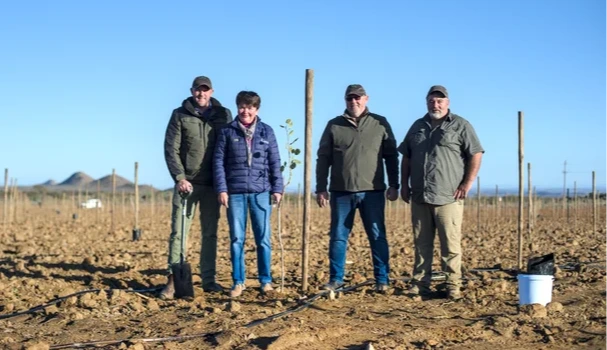 Linda Jaquet and local farmers getting ready to plant the tree