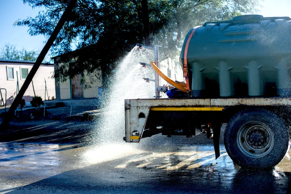 Water truck wetting the area